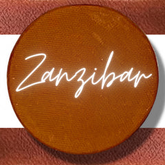 Close-up of pressed vegan eyeshadow in Zanzibar shade with smooth matte finish and compact pan