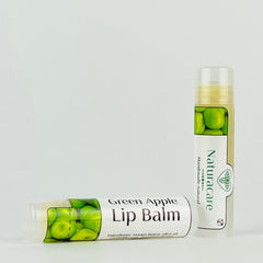 Lip balm tubes with green apple graphic, white and clear plastic, Naturacare brand visible