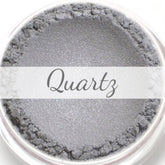 Mineral eyeshadow sample with light silver color, textured finish, and "Quartz" text