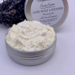 Close-up of lavender whipped body butter in white jar with rich, creamy texture and subtle purple hue