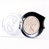 Eye shadow compact with pink shimmer powder, black rim, and Goka Club text on lid