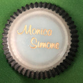 Eye makeup compact with powder blue center, black scalloped edge, and Monica Simone text