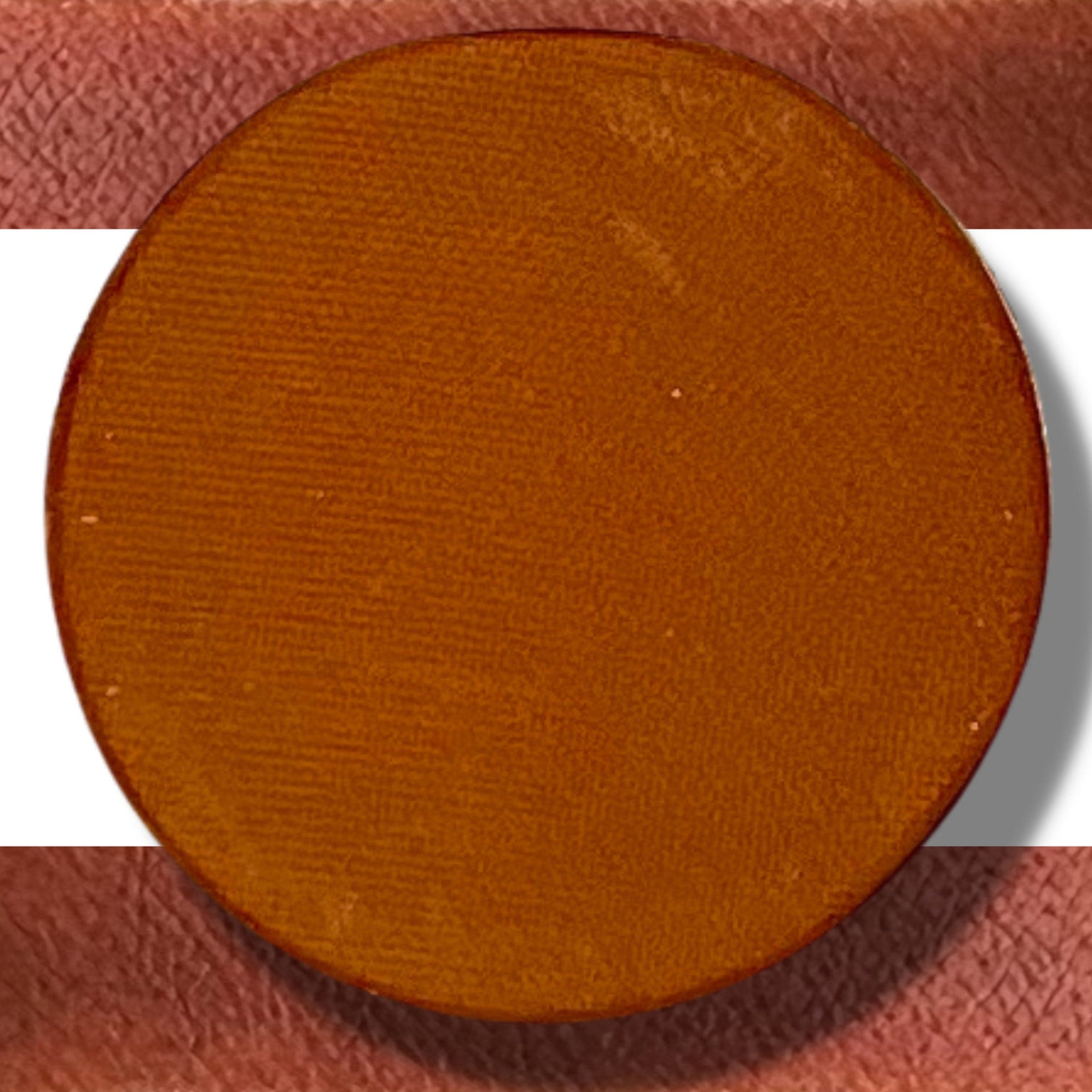 Single pressed eyeshadow in vibrant Zanzibar shade with smooth matte finish, displayed in a sleek compact case.