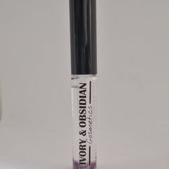 Lip gloss tube with black cap, clear gloss, and Ivory & Obsidian Cosmetics text
