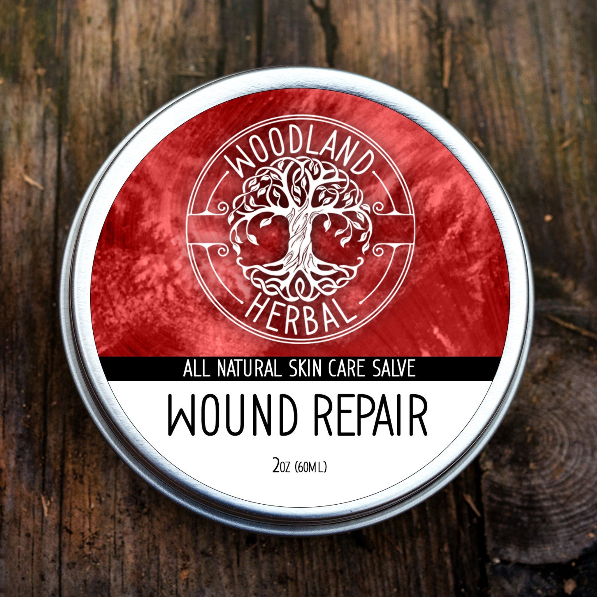 White plastic jar of wound repair salve with minimalist black label and matte finish, 2oz size