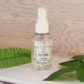 Facial toner bottle, clear plastic, white cap, "Cute Cumber" label, on a tray