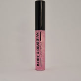 Lip gloss tube with black cap, pink iridescent gloss, and Ivory & Obsidian Cosmetics text