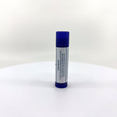 Lip balm tube with blue cap, white label, and ingredients list visible on the side