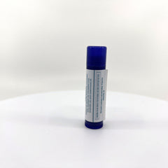 Lip balm tube with blue cap, white label, and Great Lakes Lavender Farm text