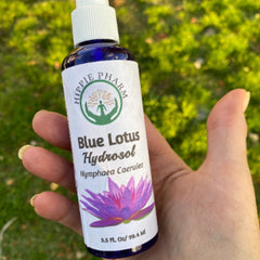 Toner bottle held in hand, blue glass bottle with white label, Hippie Pharm brand visible
