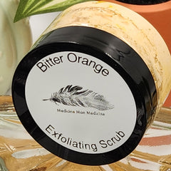 Exfoliating scrub jar with black lid, white label, and Medicine Man Medicine text