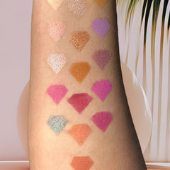 Side view of lilac eyeshadow palette showing matte and shimmer shades with smooth texture in sleek compact case