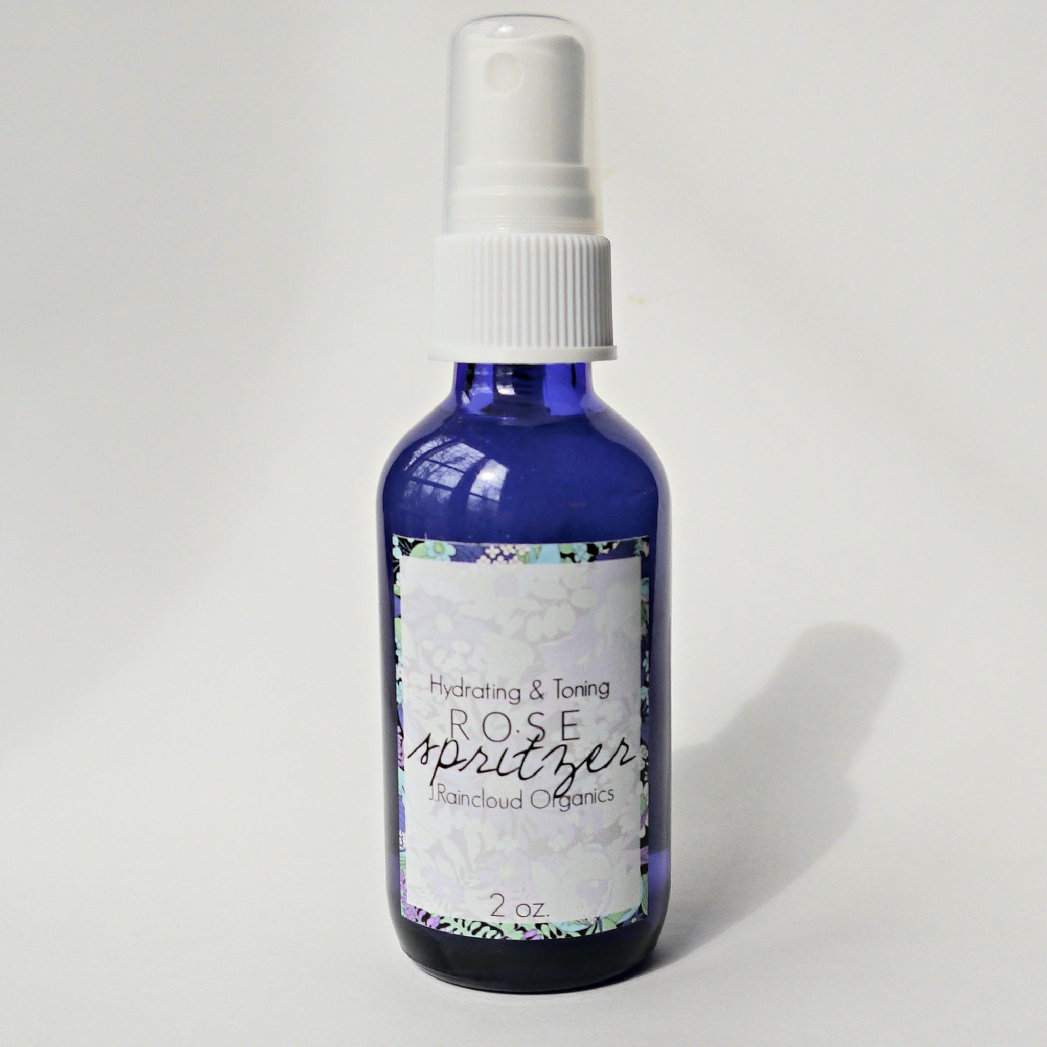 Toner spray bottle, blue glass with white spray top, JRaincloud Organics label