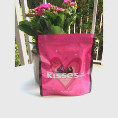 Eye makeup palette pink Hershey's KISSES x GLAMLITE packaging with heart design and brand name visible
