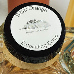Exfoliating Scrub jar with black lid, white label, and Medicine Man Medicine text