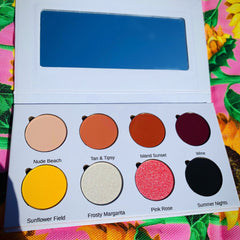 Side view of vegan eyeshadow palette showing eight sun-inspired matte and shimmer shades in warm yellows and oranges