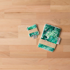 Reusable wipes with green leaf pattern and Little Miss M Designs brand label on wood surface