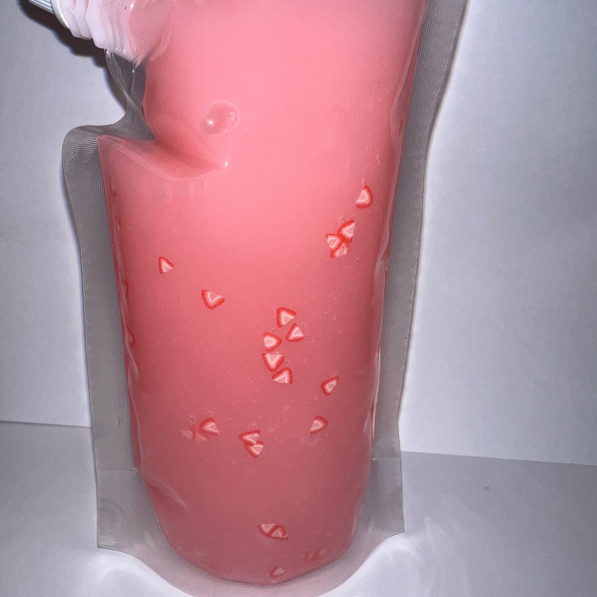 Wholesale versagel pouch pink lipgloss with strawberry slices in clear plastic pouch
