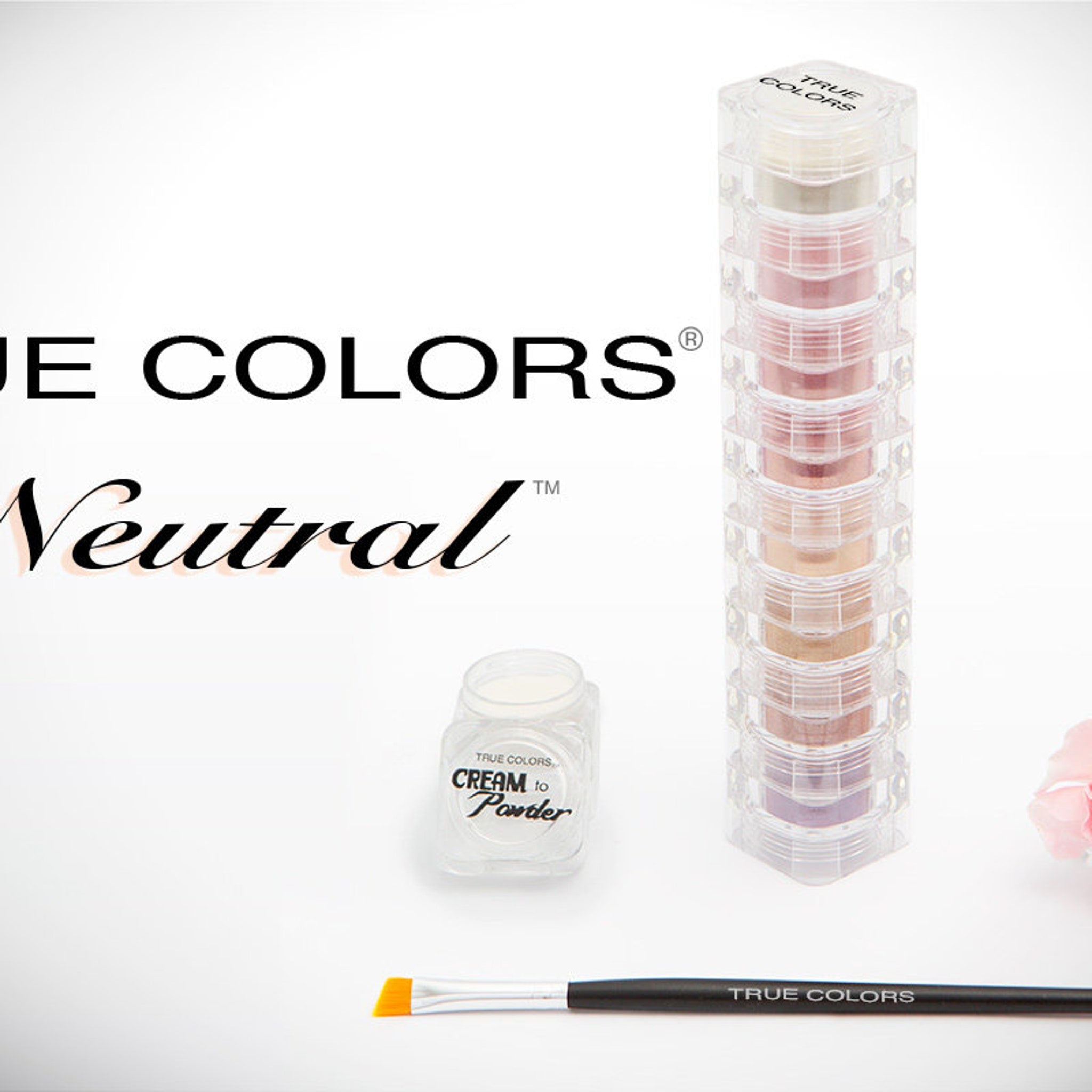 Mineral eye shadow stack with neutral colors in clear plastic containers, True Colors brand