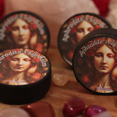 Lip balm containers with Aphrodite's Lip Balm text, black rim, woman illustration, Merakii brand