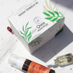 Wash towels XL box with green leaf design, white background, and "Qees essentials" brand text