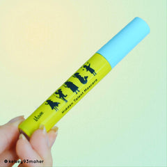 Mascara tube with yellow and blue color, black illustrations, and "Hidden Talent Mascara" text