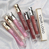 Lip gloss tubes with gold and silver caps, various colors, and "YOUR LOGO" printed on tubes and box