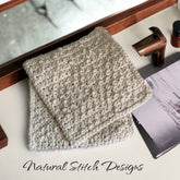 Washcloth, cream crochet cotton, folded, Natural Stitch Designs logo visible