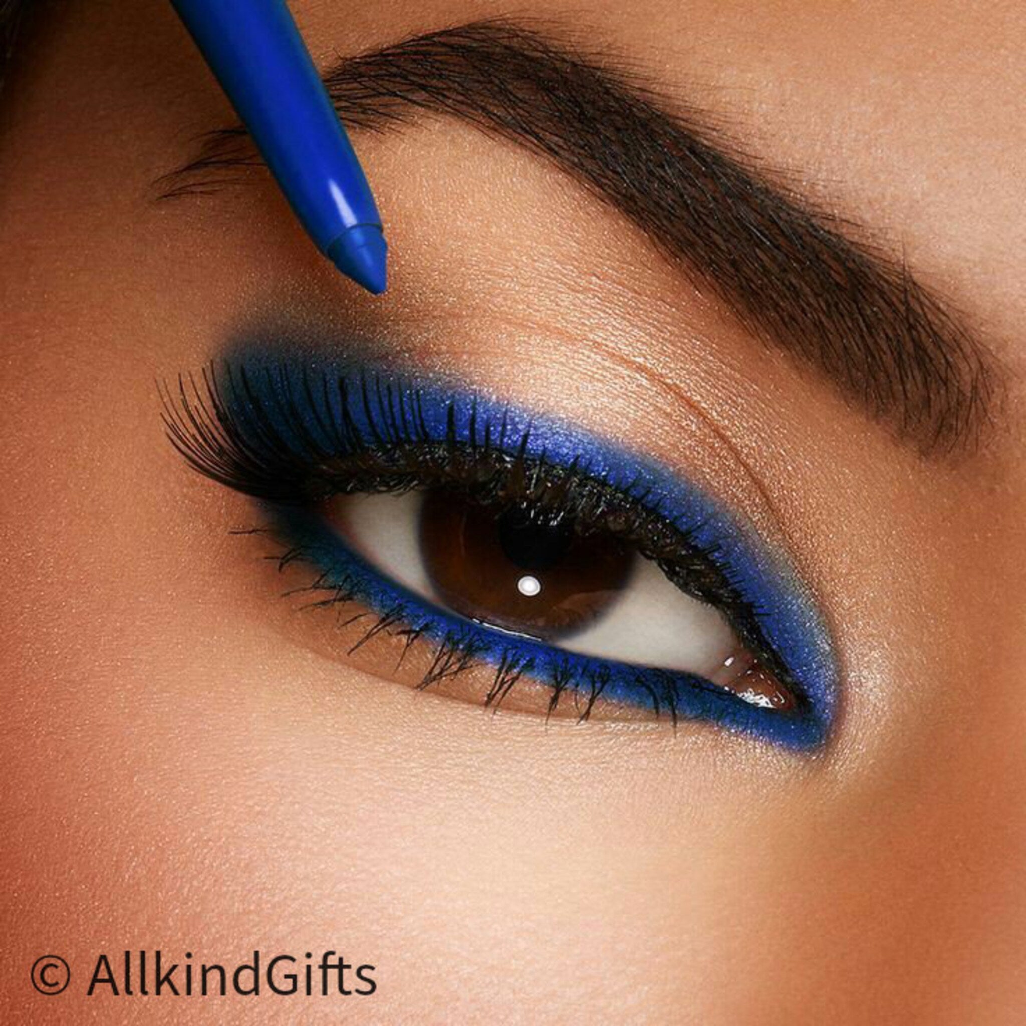 Vibrant blue vegan eyeliner pen with sleek matte black cap, showcasing precise felt tip for smooth application