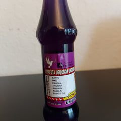 Purple glass bottle with label, white dove graphic, and text "AMAFUTA UGQOBISA UMZIMBA