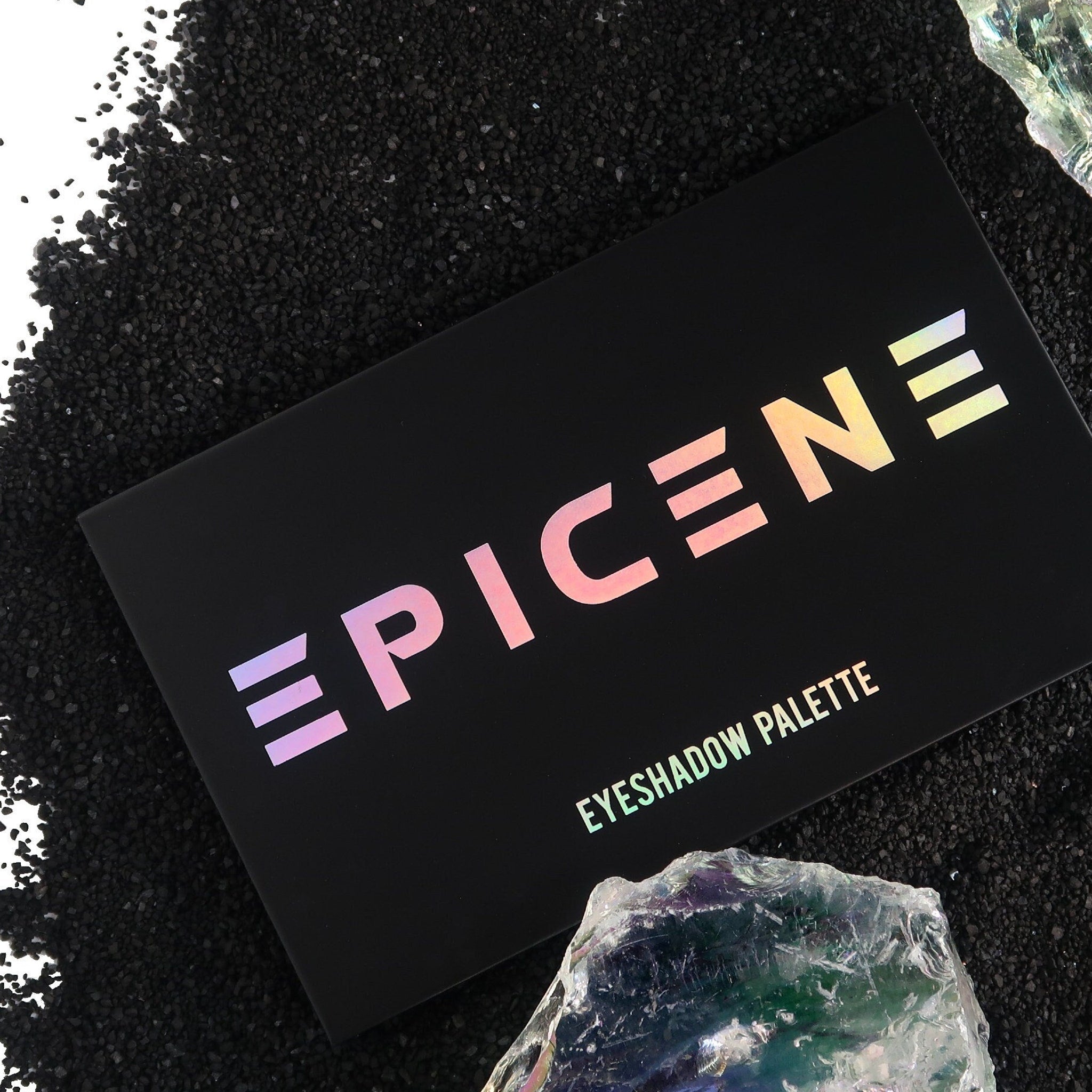 Eyeshadow palette, black rectangular case with iridescent text, "EPICENE" and "EYESHADOW PALETTE