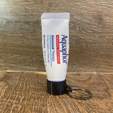 Badge & Pass Holder with Aquaphor branding, white tube, black keychain holder, metal ring