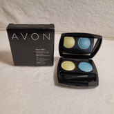 Eyeshadow duo with AVON branding, black case, and two colors: yellow and blue