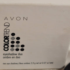 Eyeshadow duo product in white packaging with black dots and AVON logo visible