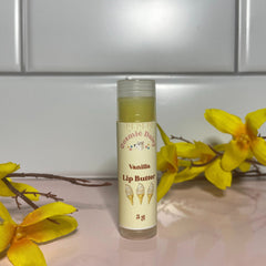 Lip Butter tube with clear cap, Cosmic Daisy label, yellow and cream colors