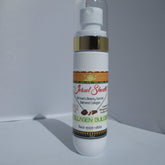 Toner bottle with white, gold, and patterned label, Jewel Sheath brand visible
