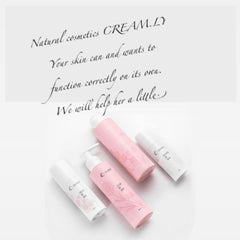 Skincare products in pink and white bottles with floral designs, CREAM.LY branding visible