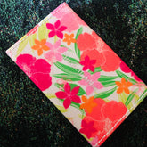 Eye shadow compact with floral pattern, Elizabeth Arden brand, and white stitched edge