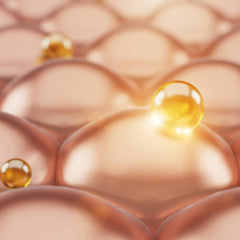 Skin cells with yellow spheres, peach and gold tones, close-up view