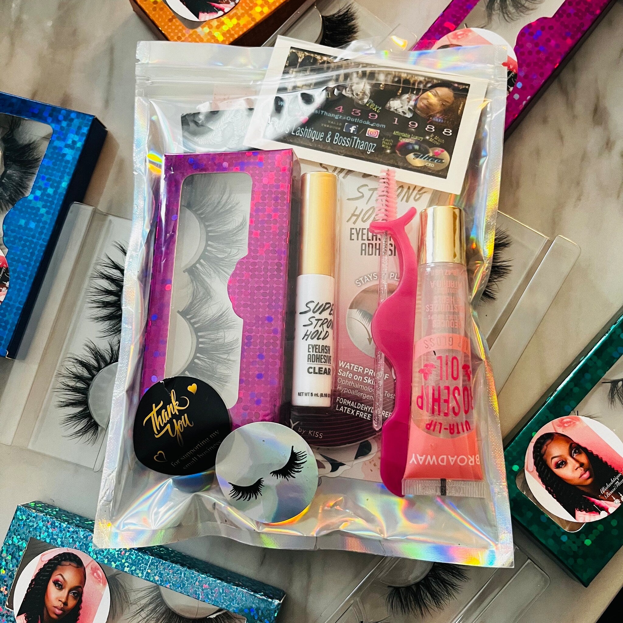 Lash kit with black lashes, pink applicator, and BOSSITHANGZ brand packaging