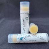 Lip balm tubes with white labels, yellow balm, and Copeland Creations text visible