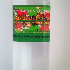 Toner bottle with green and red label, Garden of Essence text visible, for facial use