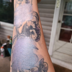 Multichrome eyeshadow duo with shifting iridescent hues in compact mirrored palette, showcasing color transformation.