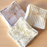Stack of soft eco-friendly cotton gauze and bamboo wipes in neutral tones for gentle makeup removal and skincare