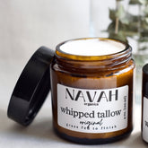 White ceramic jar of whipped tallow balm with gold lid and minimalist label, showcasing rich texture