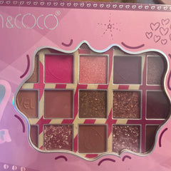 Eye shadow palette with pink, brown, and glitter shades, Kevin & Coco brand name visible
