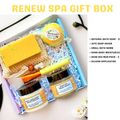 Spa gift box with yellow bath soap, jute soap saver, and skincare products in a blue box