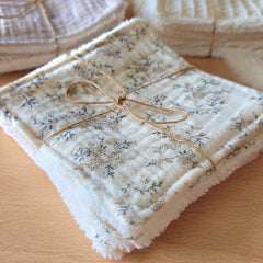 Close-up of soft bamboo and cotton wipes with textured weave, folded neatly in eco-friendly packaging