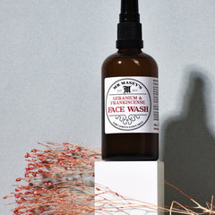 Face wash bottle brown glass with black pump and Mr. Masey's label on white block