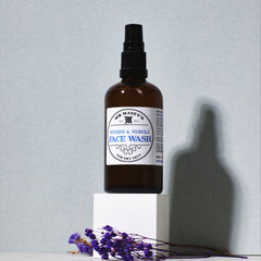 Face wash bottle with brown glass, black pump, and white label, Mr. Masey brand